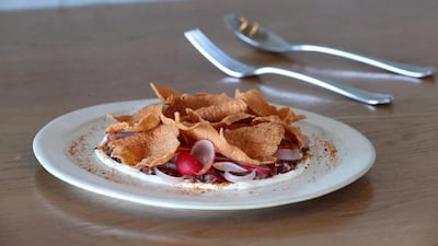 On the lunch and dinner menu: smoked organic beef tartare, with chipotle and soured onion cream, plus radish. Chris Whiteoak / The National