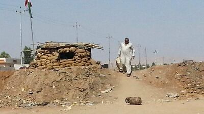 A file photo of an Iraqi refugee man who left his hometown of Mosul walking towards Erbil. The Iraqi military and militia forces on March 24, 2016 began an operation to retake Mosul from ISIL extremists. AP Photo