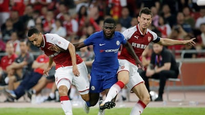 Chelsea's Jeremie Boga is tackled by Arsenal's Francis Coquelin and Laurent Koscielny. Jason Lee / Reuters