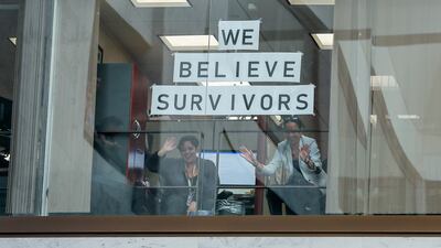 Congressional members of staff watch as protesters gather. Erik S Lesser / EPA