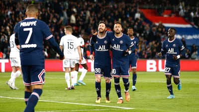 Lionel Messi celebrates with Kylian Mbappe and Neymar after scoring PSG's fourth goal against Lorient. EPA
