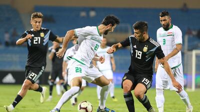 Iraqi player Rebin Ghareeb Solaka (C) in action with Argentine player Simeone Giovanni (R) during the international friendly soccer match between Argentina and Iraq, in Riyadh, Saudi Arabia. EPA