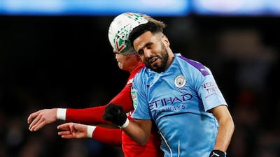 Manchester United's Brandon Williams takes on Manchester City's Riyad Mahrez. Reuters