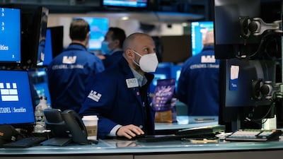 Traders work on the floor of the New York Stock Exchange in New York City. AFP