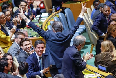 Portuguese Ambassador to the UN Rui Vinhas gestures in celebration after Portugal won a seat as a non-permanent member of the UN Secruituy Council. AFP