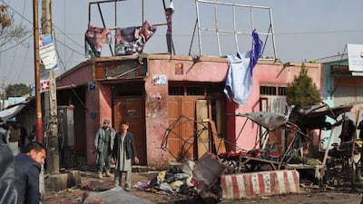 Afghan security officials inspect the scene of a suicide bomb attack in Maimanah, Faryab province, Afghanistan on March 18. EPA