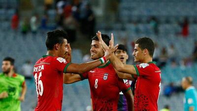Reza Ghoochannejhad, Morteza Pouraliganji and Vouria Ghafouri of Iran react after defeating Qatar in Sydney on January 15. Daniel Munoz / Getty Image