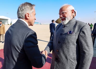 India's Prime Minister Narendra Modi, right, was greeted by Jordan’s Prime Minister Jafar Hassan at the airport in Amman. AFP