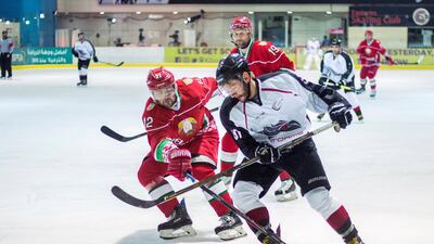 Luka Vukoja, No 91, of the Abu Dhabi Storms in action against Karshunou Andrei, No 12, of Belarus in the President's Cup at the Zayed Sport City Ice Rink. Leslie Pableo for The National