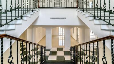 The staircase adds a sense of grandeur. Courtesy LuxuryProperty.com