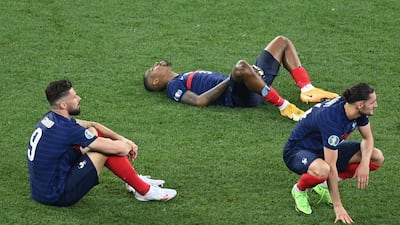 France's players react to their defeat. AFP