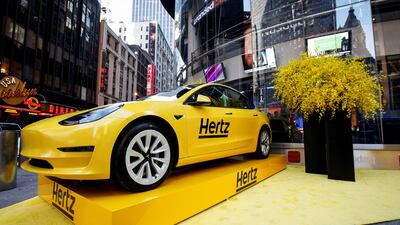A Hertz Tesla electric vehicle is displayed during the Hertz Corporation IPO at the Nasdaq Market site in Times Square, New York, in 2021. Reuters