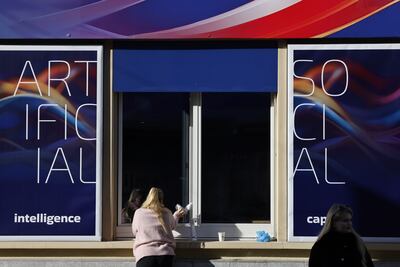 A worker cleans a window before the start of the World Economic Forum in Davos, Switzerland. Bloomberg