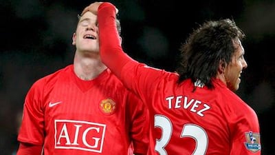 Wayne Rooney, left, and Carlos Tevez during their Manchester United playing days.