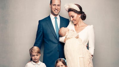 Following Prince Louis' baptism, the Duchess of Cambridge, holds Prince Louis as they pose with Prince William, the Duke of Cambridge, Prince George and Princess Charlotte. Kensington Palace via AP