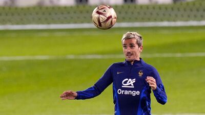 France's Antoine Griezmann controls the ball during training. AP