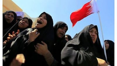 Family members and others mourn at the funeral yesterday of Abdulrusul Hajair, apparently beaten to death during unrest in Bahrain.