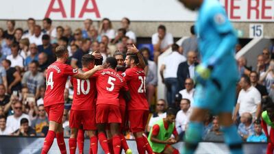 Liverpool players celebrate after James Milner scored. Justin Tallis / AFP