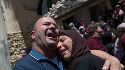 Palestinian mourners cried as they took a last look at the body of Ahmed Daraghmeh during his funeral in the West Bank village of Lubban. AP