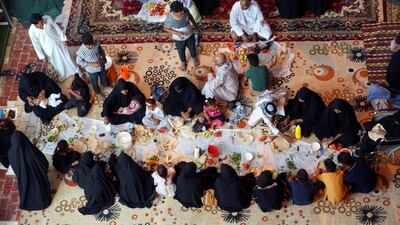 An Iraqi family breaks fast during the month of Ramadan in Hilla, Iraq. Reuters