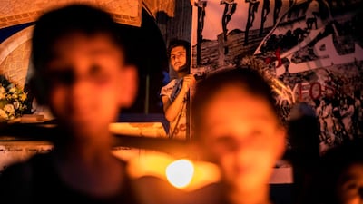 Members of Syria's Syriac Christian minority attend a ceremony to mark the mass killing of the Assyrian civilian population more than a century ago, on in Qamishli in the country's northeastern Hasakah province. AFP