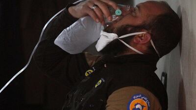 A civil defence member breathes through an oxygen mask after the gas attack in the town of Khan Sheikhoun in Idlib, Syria on April 4, 2017. Ammar Abdullah / Reuters