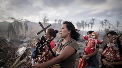 1st Prize, Spot News Single: Survivors of typhoon Haiyan marching during a religious procession in Tolosa, Philippines. Phillipe Lopez / Reuters