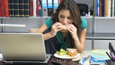 Intutive eating requires you to eat slow and only until you're full, which is why you should avoid eating at your desk or in front of a screen. Getty