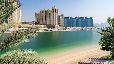 The trunk of the Palm and Dubai Marina are visible from the garden.
