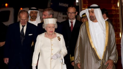 The queen and Prince Philip with President Sheikh Mohamed, then Crown Prince of Abu Dhabi, at Abu Dhabi airport on November 24, 2010. Getty