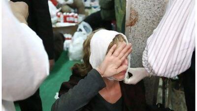 An injured foreign photographer receives treatment on February 3 at a makeshift hospital set up in a mosque in Tahrir Square, Cairo.