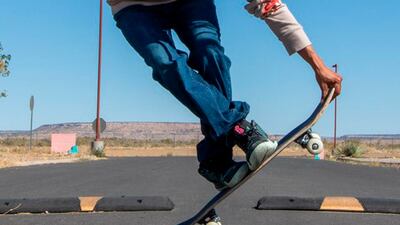 Terrill Humeyestewa performing a skateboard trick in the Village of Tewa. AP