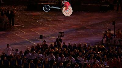 A wheelchair racer cuts through the air above the performances at the 2012 Paralympics opening. Lefteris Pitarakis/AP