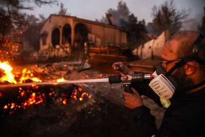 Volunteers attempt to extinguish a wildfire in Vrilissia, on the outskirts of Athens. AFP