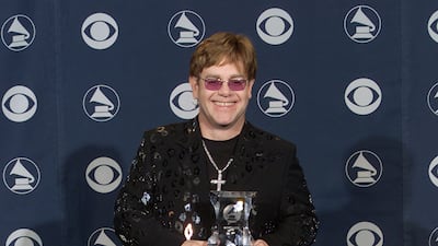 Elton John, in a black suit with a black sequinned animal print pattern, at the 2000 Grammy Awards in Los Angeles on February 23, 2000. ImageDirect