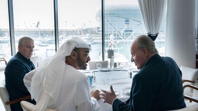 Sheikh Mohammed bin Zayed, Crown Prince of Abu Dhabi and Deputy Supreme Commander of the UAE Armed Forces, meets with Prince Andrew, Duke of York, left, and Juan Carlos I, former King of Spain, at Cipriani restaurant, on the second day of the Formula 1 Etihad Airways Abu Dhabi Grand Prix. Mohamed Al Hammadi / Crown Prince Court - Abu Dhabi