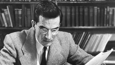 Bibical Scholar Dr. Frank Cross Jr. studying the Dead Sea Scrolls in 1955. Getty Images