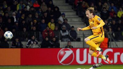 Ivan Rakitic of Barcelona scores a goal past Bate Borisov keeper Sergei Chernik in Barca’s 2-0 Champions League win on Tuesday night. Tatyana Zenkovich / EPA