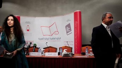 The Saudi author Raja Alem, left, and Moroccan writer Mohammed Achaari were both awarded this year's International Prize for Arabic Fiction.