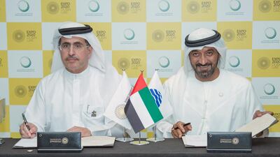 Above, Sheikh Ahmed bin Saeed, Chairman of Expo 2020 Dubai Higher Committee, right, and Saeed Al Tayer, chief executive of Dewa, during the signing ceremonies. Courtesy Expo 2020 Dubai