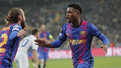 Barcelona's Ansu Fati celebrates with teammate Oscar Mingueza after scoring the winner against Dynamo Kiev in the Champions League on Tuesday. EPA