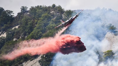 Among other countries, France battled huge fires, some near popular tourist beaches along the Cote d'Azur, for weeks. Yann Coatsaliou / AFP