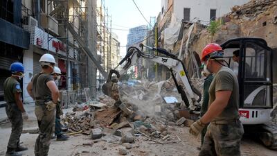 UN peacekeepers help clear the ruins at Beirut's Mar Mikhael neighbourhood, following the massive port explosion in August. The blast has exacerbated the country's worst economic crisis. EPA