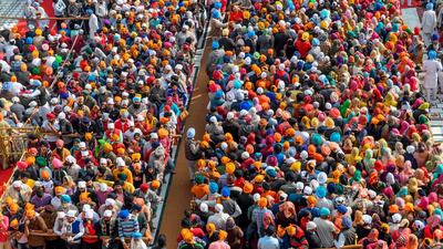 Sikh devotees pay respect on the occasion of the martyrdom day of the 9th Sikh Guru, Guru Tegh Bahadur Sahib, at the Golden Temple in Amritsar. AFP