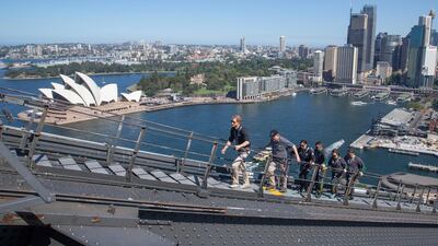 Prince Harry, Australia's Prime Minister Morrison and Invictus Games representatives climb the Sydney Harbour Bridge. AP Photo