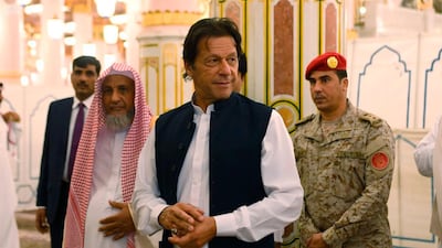 Pakistani Prime Minister Imran Khan visits the Prophet's Mosque in Madinah, Saudi Arabia. Saudi Press Agency via AP