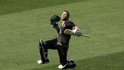 Australia opener David Warner celebrates after scoring a century during the Twenty20 International match against Sri Lanka at the Adelaide Oval on Sunday. Getty