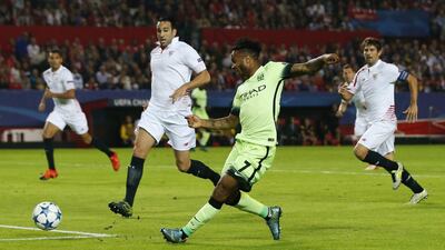 Raheem Sterling of Manchester City shoots and scores their first goal on Tuesday night against Sevilla in the Champions League. Andrew Boyers / Action Images / Reuters
