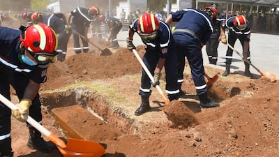 Algerian firefighters lay to rest the remains of 24 resistance fighters, returned from Paris after more than a century and a half. AFP