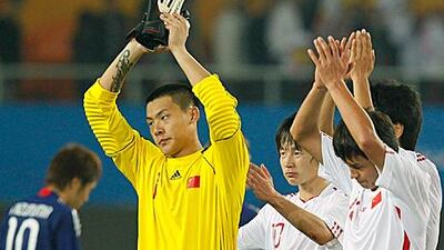 Wang Dalei gestures to the crowd after China’s loss to Japan in their opening match as the Asian Games.